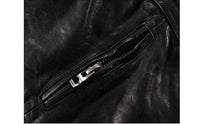 Close-up of a zipper on a men's slim-fit black goatskin leather motorcycle jacket made from genuine leather.