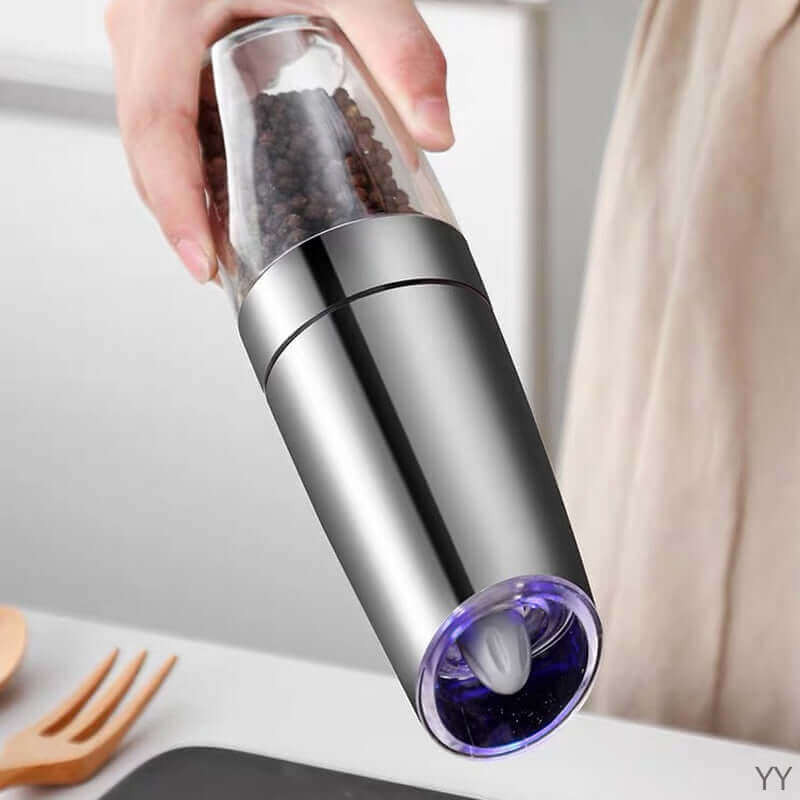 hand holding Automatic Grinder