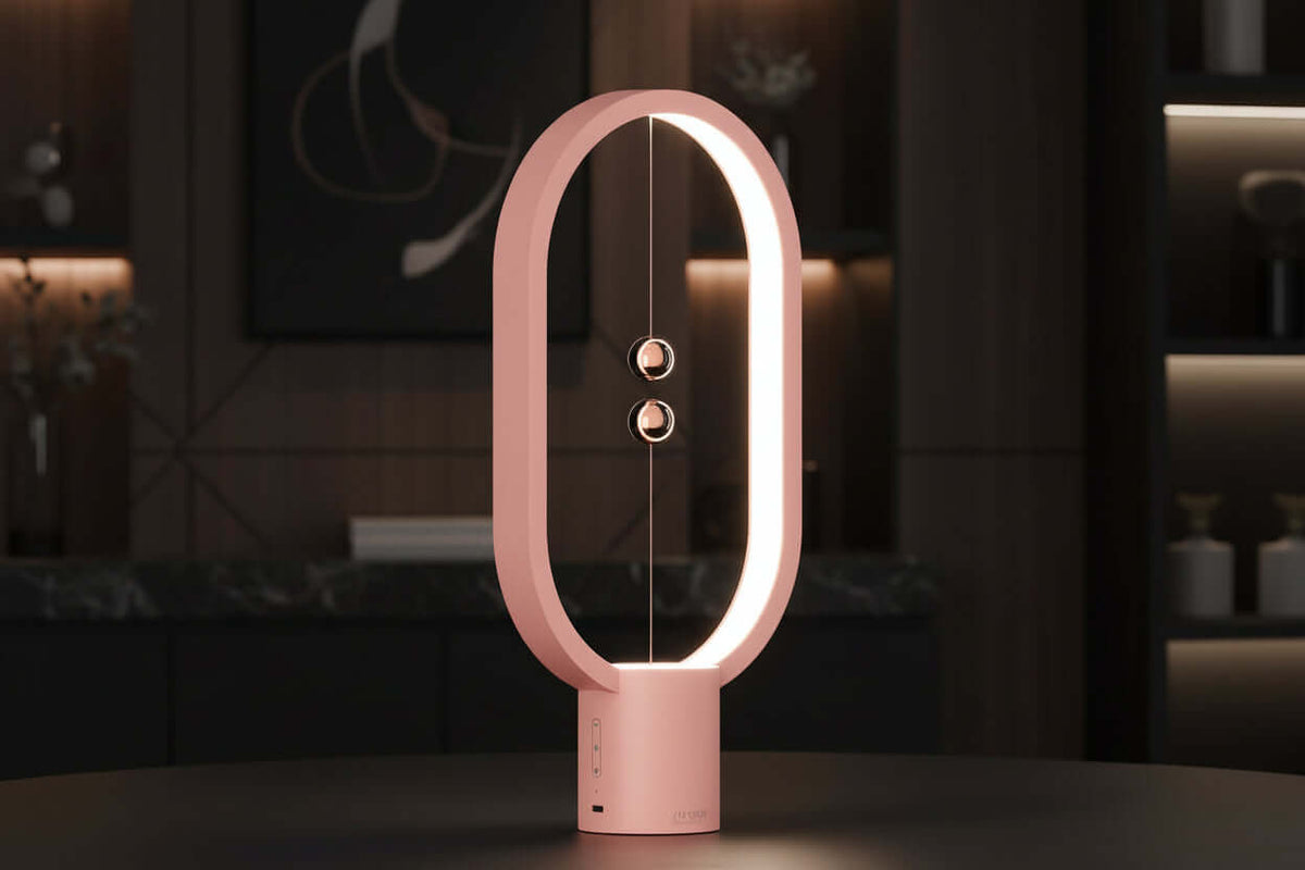 Pink lamp with circular design on a dark background